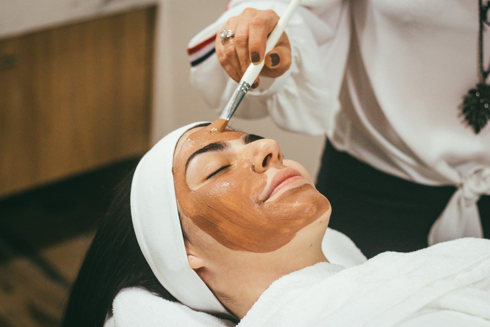 Aesthetician performing a treatment at a med-spa
